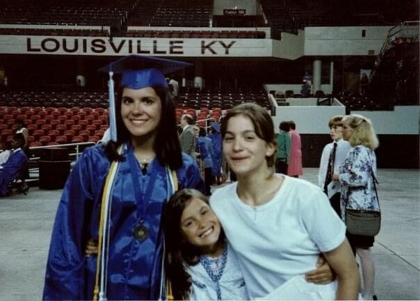 Sisters smile at UofL graduation